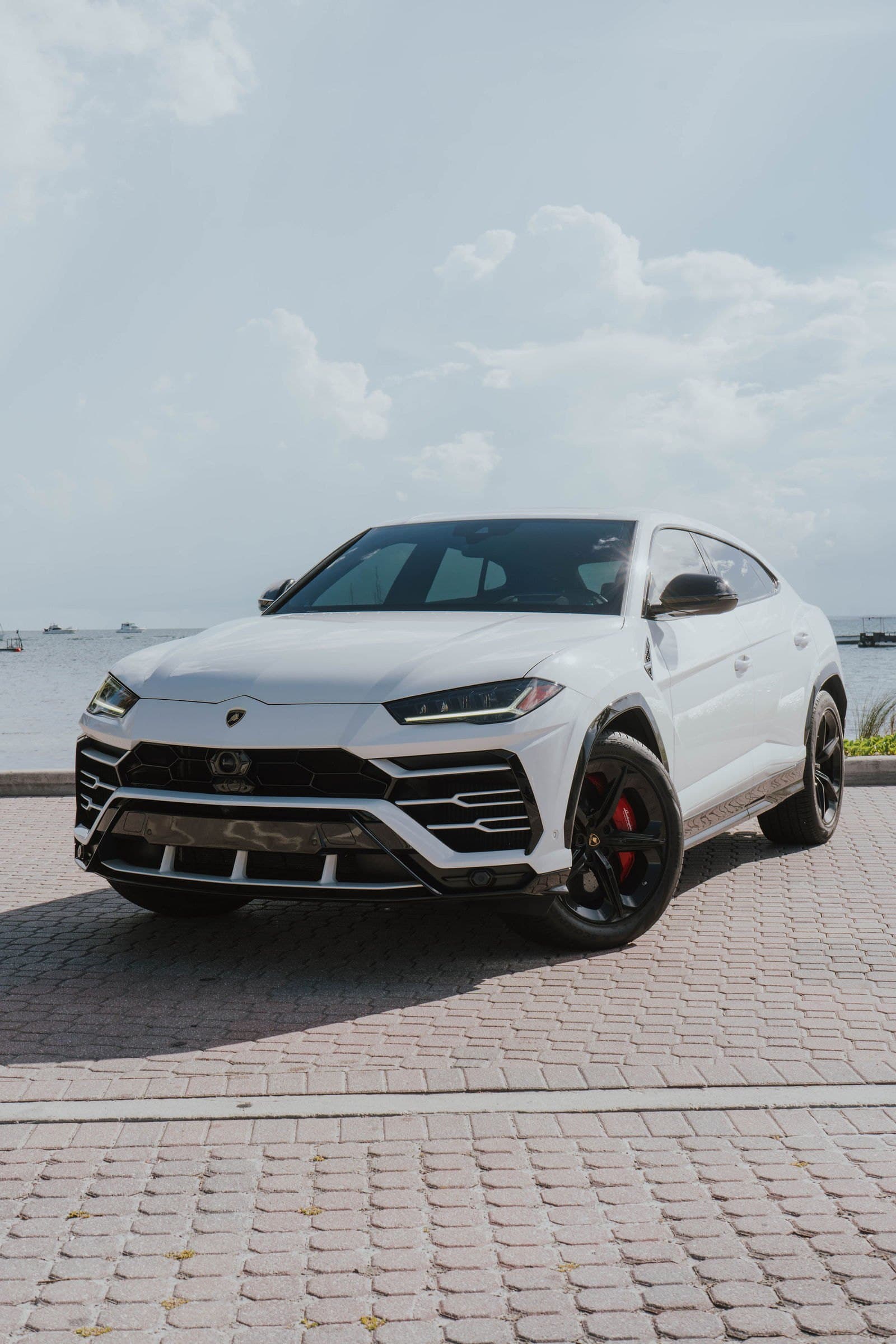 White Lamborghini Urus parked at the Miami waterfront