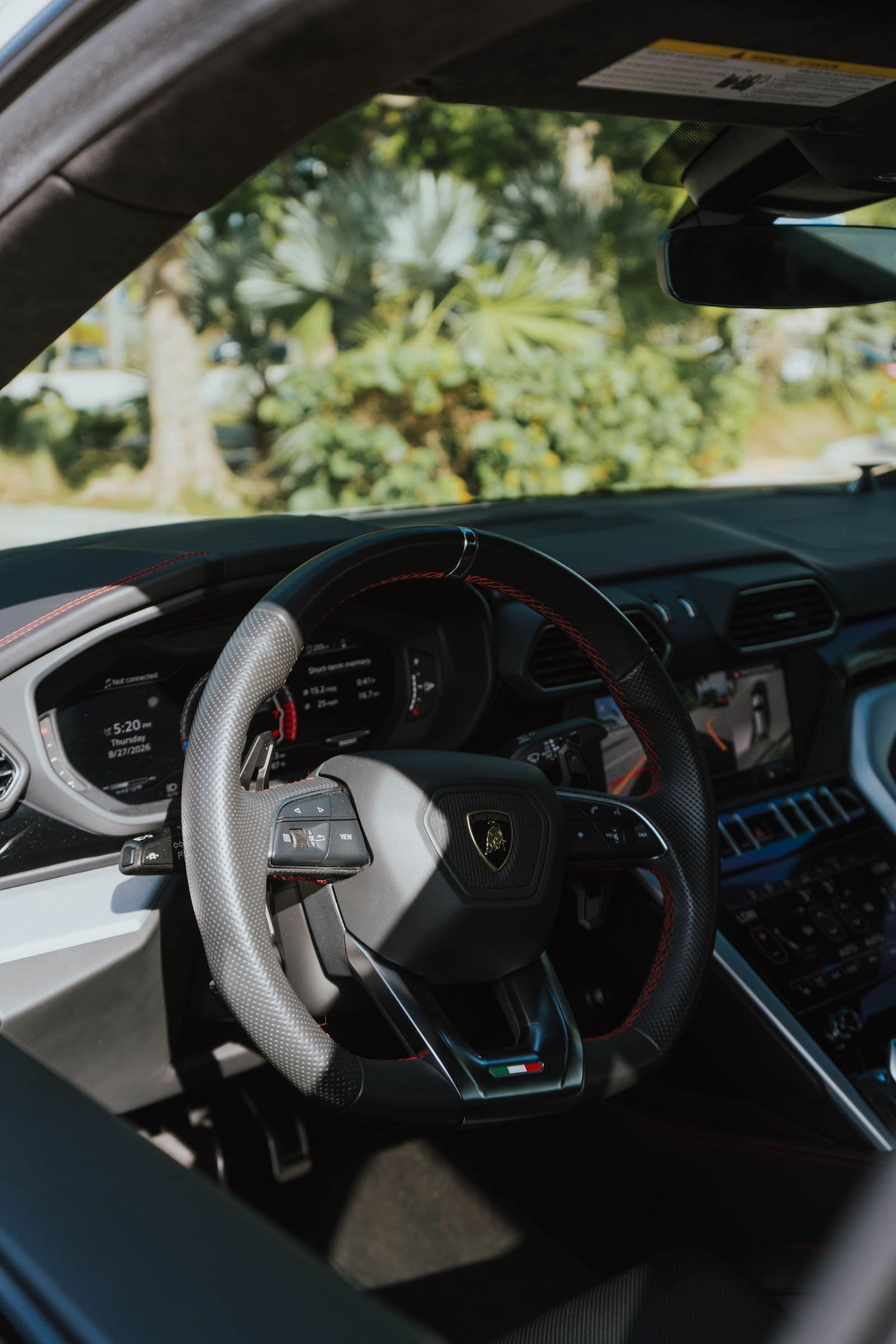 Steering wheel and interior of a Lamborghini Urus